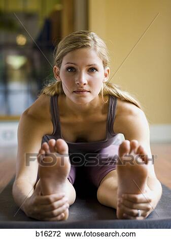 Woman doing yoga View Large Photo Image Stock Image - Woman doing yoga. Fotosearch