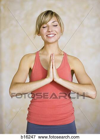 Stock Photo - Woman doing yoga. Fotosearch