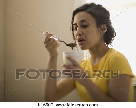 Woman eating ice cream View Large Photo Image Stock Image - Woman eating ice cream. Fotosearch
