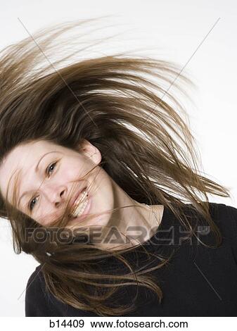 Woman flipping hair View Large Photo Image Stock Photo - Woman flipping hair. Fotosearch
