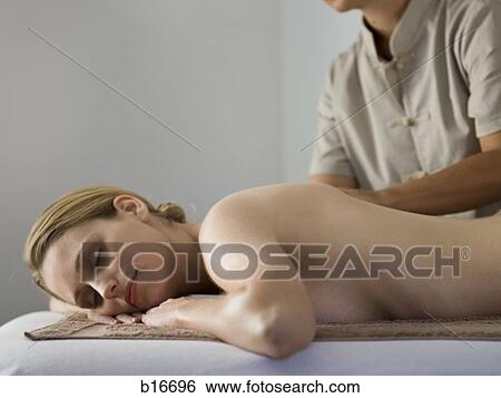 Woman giving other woman back massage View Large Photo Image Stock Photograph - Woman giving other woman back massage. Fotosearch