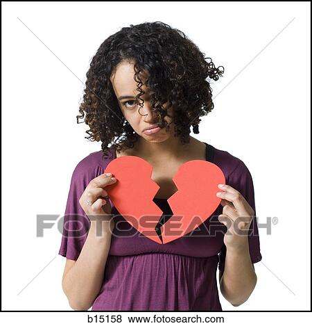 Woman holding broken red heart View Large Photo Image Stock Photo - Woman holding broken red heart. Fotosearch