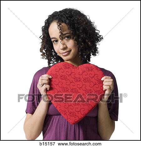 Woman holding red heart View Large Photo Image Stock Photo - Woman holding red heart. Fotosearch