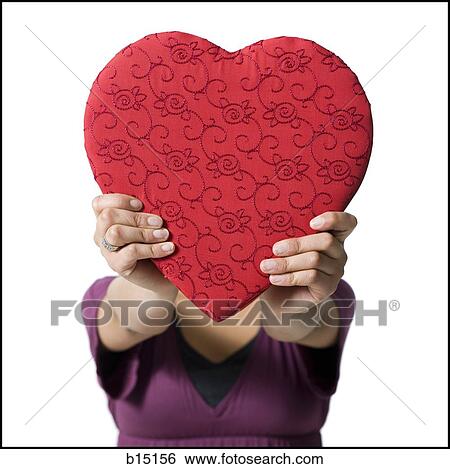 Woman holding red heart View Large Photo Image Stock Photograph - Woman holding red heart. Fotosearch