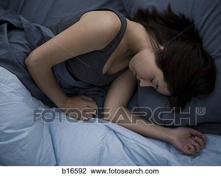 Woman in bed sleeping View Large Photo Image Stock Image - Woman in bed sleeping. Fotosearch