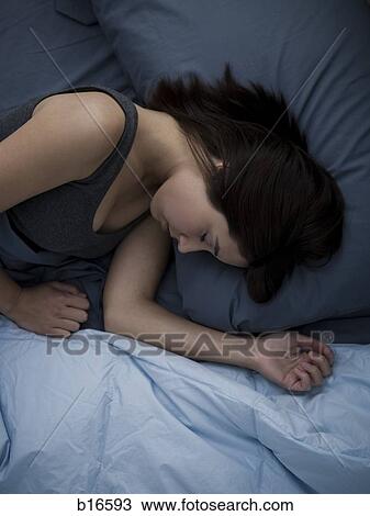 Woman in bed sleeping View Large Photo Image Stock Image - Woman in bed sleeping. Fotosearch