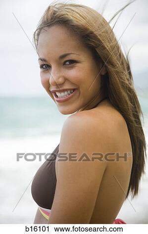 Woman in bikini smiling outdoors View Large Photo Image Stock Image - Woman in bikini smiling outdoors. Fotosearch