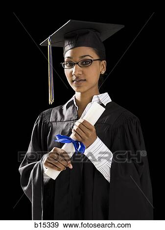 Stock Photo - Woman in graduation gown and Blank Sign with diploma. Fotosearch