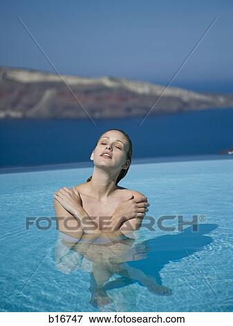 Woman in pool outdoors View Large Photo Image Stock Photo - Woman in pool outdoors. Fotosearch