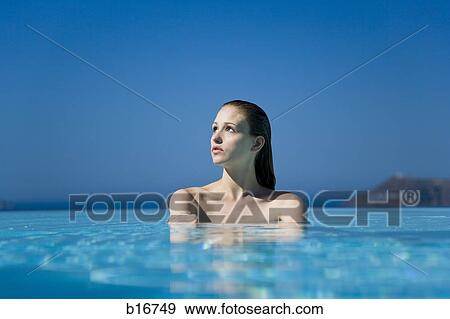 Stock Photo - Woman in pool outdoors. Fotosearch