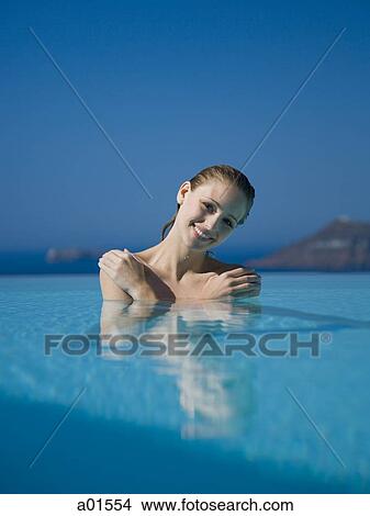 Woman in pool smiling View Large Photo Image Picture - Woman in pool smiling. Fotosearch