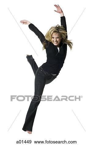 Woman jumping and smiling View Large Photo Image Stock Photo - Woman jumping and smiling. Fotosearch