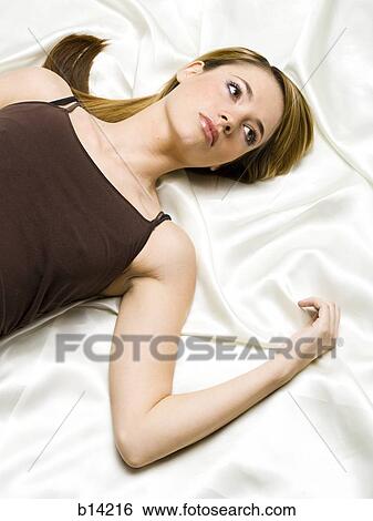 Woman laying down View Large Photo Image Stock Photograph - Woman laying down. Fotosearch