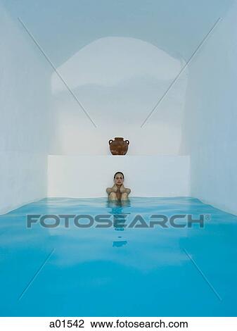 Woman leaning against wall with knees up in pool with urn View Large Photo Image Stock Image - Woman leaning against wall with knees up in pool with urn. Fotosearch