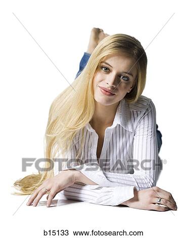 Woman lying down and smiling View Large Photo Image Stock Image - Woman lying down and smiling. Fotosearch