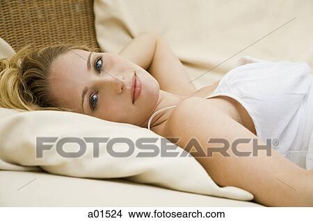 Woman lying down View Large Photo Image Picture - Woman lying down. Fotosearch