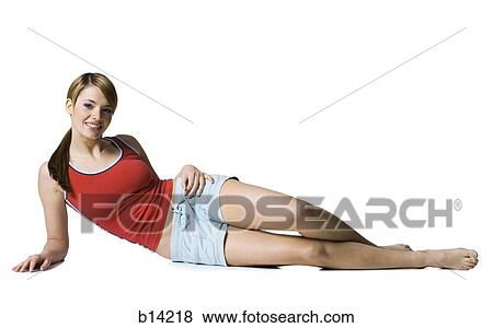 Woman lying down smiling View Large Photo Image Stock Photo - Woman lying down smiling. Fotosearch