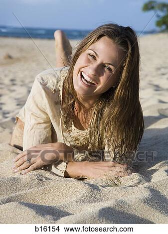 Woman on beach laughing View Large Photo Image Picture - Woman on beach laughing. Fotosearch