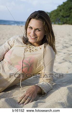 Woman on beach smiling View Large Photo Image Stock Image - Woman on beach smiling. Fotosearch