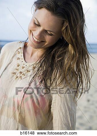 Woman on beach smiling View Large Photo Image Stock Photo - Woman on beach smiling. Fotosearch