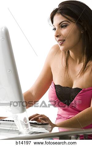 Stock Photo - Woman on computer. Fotosearch