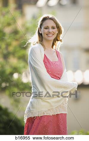 Woman outdoors smiling View Large Photo Image Stock Photography - Woman outdoors smiling. Fotosearch