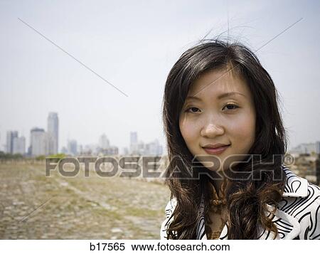 Stock Photography - Woman outdoors smiling. Fotosearch