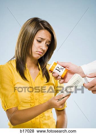 Woman paying for prescription View Large Photo Image Stock Photo - Woman paying for prescription. Fotosearch