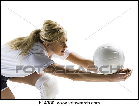 Stock Image - woman playin volleyball. Fotosearch