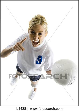 Stock Image - woman playin volleyball. Fotosearch