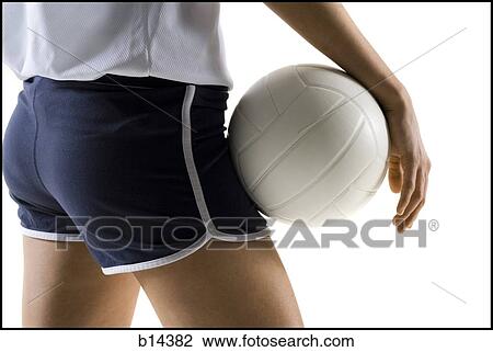 Stock Image - woman playin volleyball. Fotosearch