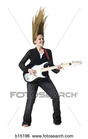 Woman playing electric guitar View Large Photo Image Stock Photograph - Woman playing electric guitar. Fotosearch