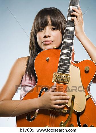 Woman playing guitar View Large Photo Image Stock Photography - Woman playing guitar. Fotosearch