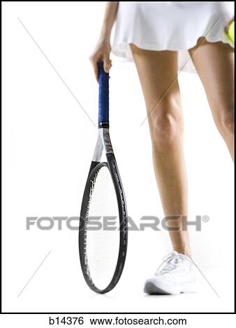 Stock Photograph - woman playing tennis. Fotosearch