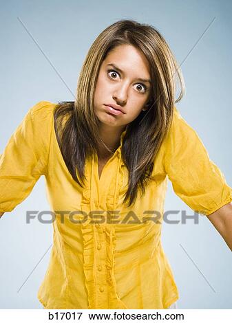 Woman shrugging View Large Photo Image Stock Photo - Woman shrugging. Fotosearch