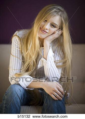Woman sitting and smiling View Large Photo Image Stock Image - Woman sitting and smiling. Fotosearch