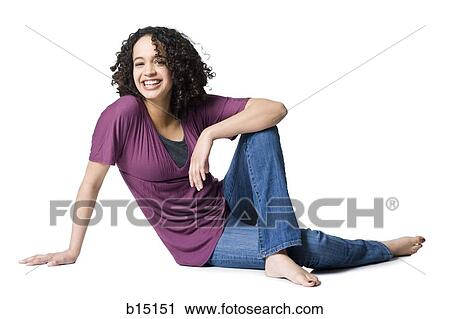 Woman sitting and smiling View Large Photo Image Stock Image - Woman sitting and smiling. Fotosearch