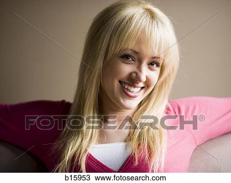 Woman sitting and smiling View Large Photo Image Stock Image - Woman sitting and smiling. Fotosearch