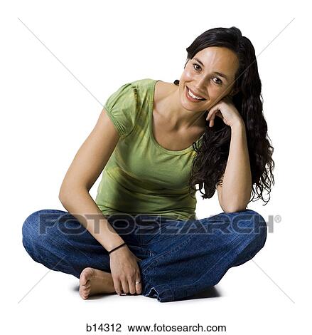 Woman sitting cross legged smiling View Large Photo Image Stock Image - Woman sitting cross legged smiling. Fotosearch