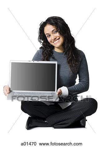 Woman sitting cross legged with laptop View Large Photo Image Stock Image - Woman sitting cross legged with laptop. Fotosearch