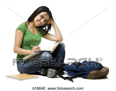 Woman sitting cross legged with backpack doing homework View Large Photo Image Stock Image - Woman sitting cross legged with backpack doing homework. Fotosearch
