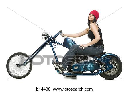 Woman sitting on motorcycle with skullcap View Large Photo Image Stock Photo - Woman sitting on motorcycle with skullcap. Fotosearch