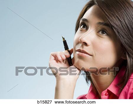 Woman sitting with fountain pen View Large Photo Image Stock Photo - Woman sitting with fountain pen. Fotosearch