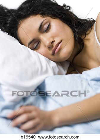 Woman sleeping in bed View Large Photo Image Stock Image - Woman sleeping in bed. Fotosearch