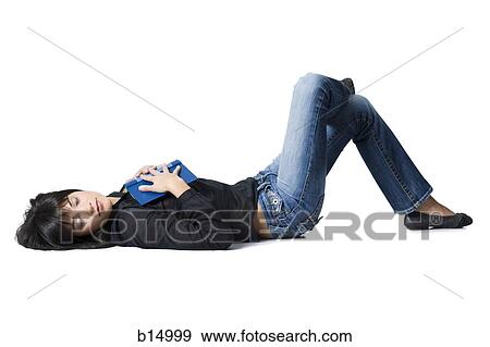 Woman sleeping with hardcover book View Large Photo Image Stock Photo - Woman sleeping with hardcover book. Fotosearch
