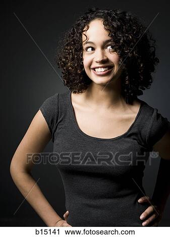 Woman smiling and looking up View Large Photo Image Stock Image - Woman smiling and looking up. Fotosearch