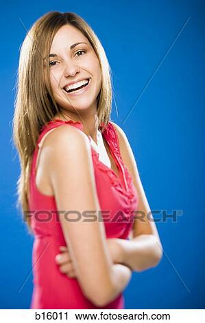 Woman smiling with arms crossed View Large Photo Image Stock Image - Woman smiling with arms crossed. Fotosearch
