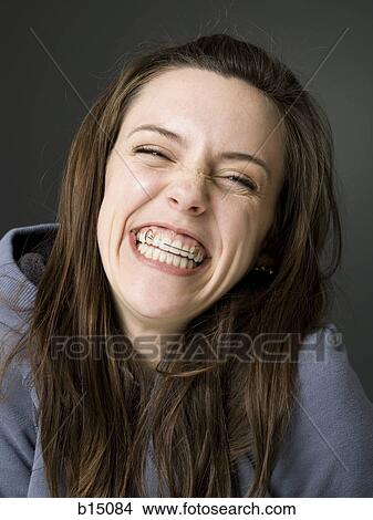 Woman smiling with dental retainer View Large Photo Image Picture - Woman smiling with dental retainer. Fotosearch