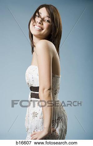 Woman smiling with hands on hips View Large Photo Image Stock Photo - Woman smiling with hands on hips. Fotosearch