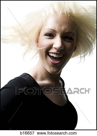 Woman smiling with tossed hair View Large Photo Image Stock Photo - Woman smiling with tossed hair. Fotosearch